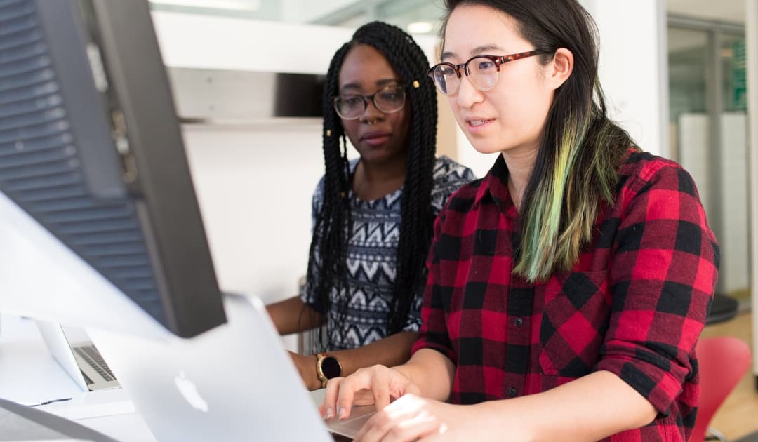 Two women working together