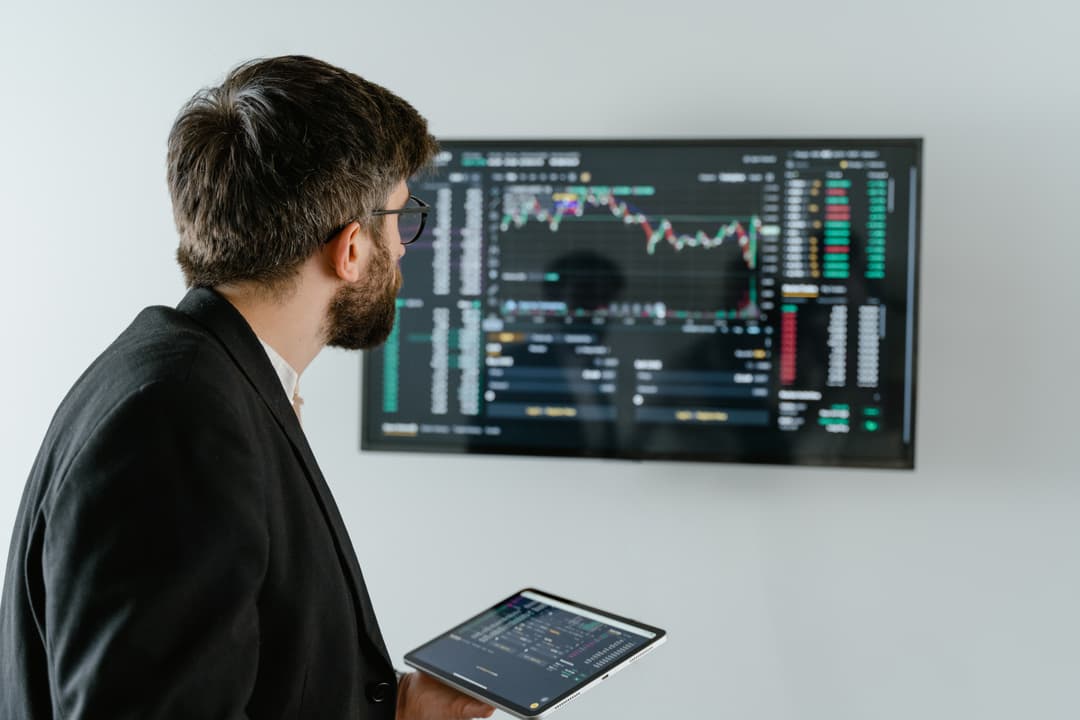 A man analysing data on a screen