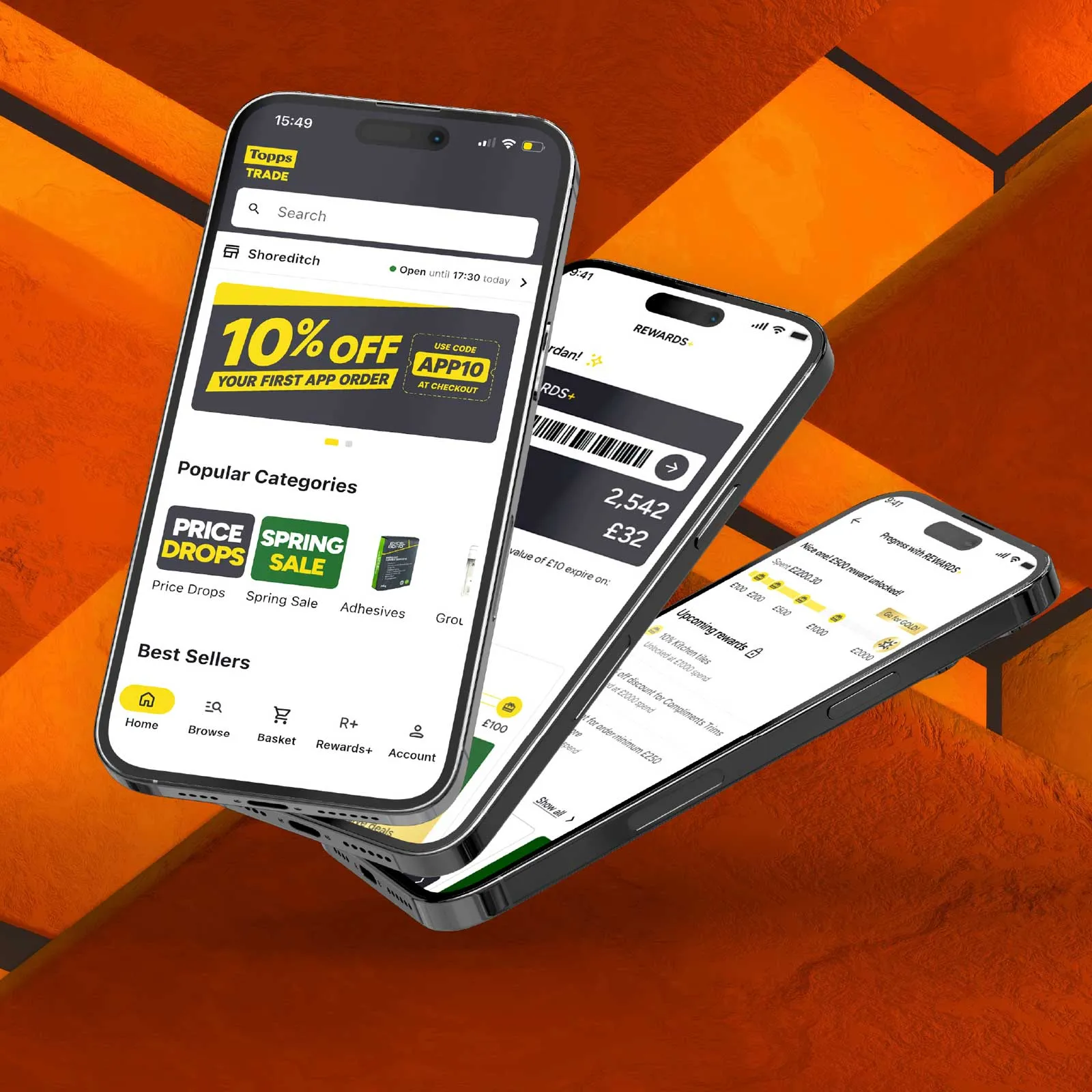 A phone showing the Topps Tiles app peeks out of the pocket of a man's pair of orange shorts.