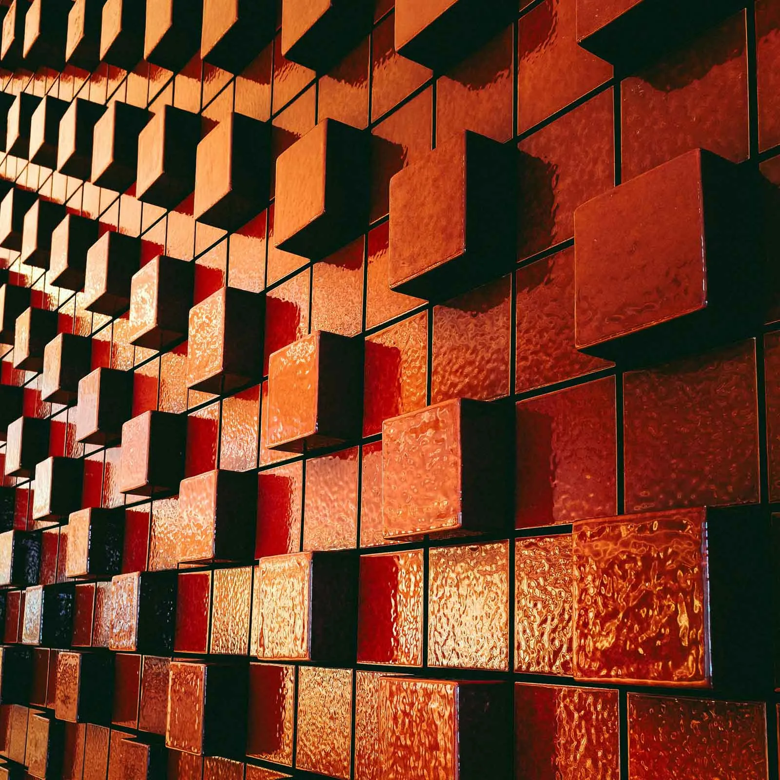 Abstract wall made of orange squares.