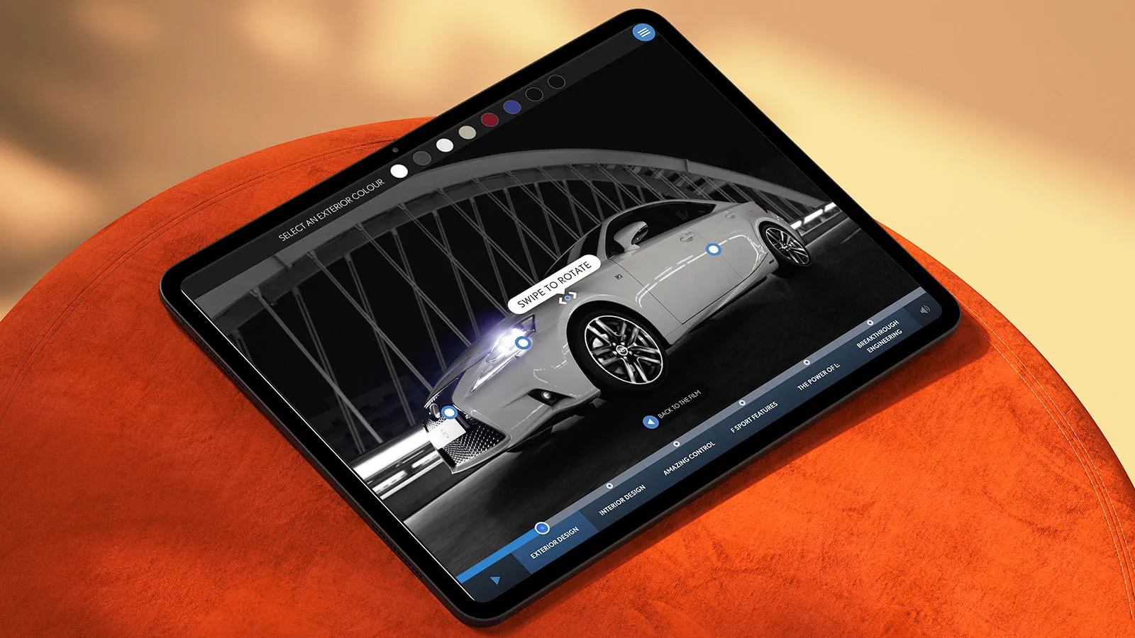 An iPad placed on an orange stool, showing the Lexus app.